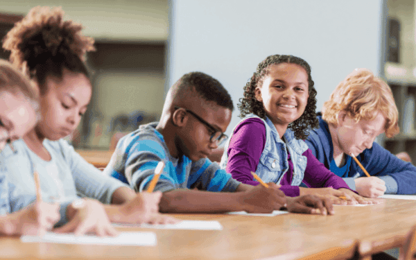 Students working and smiling